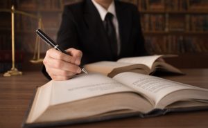 lawyer writing on books