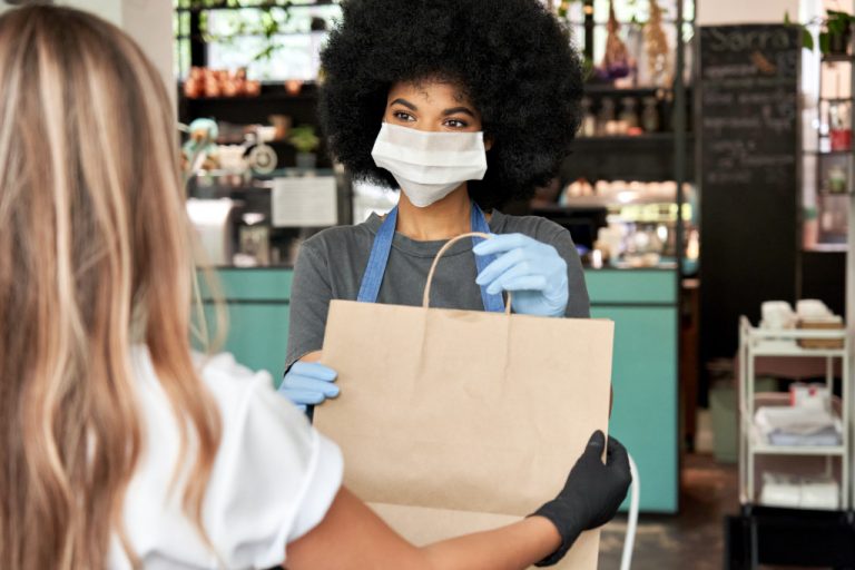 woman hand over the purchased item with care