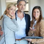 real estate agent with couple clients