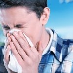 a sneezing man