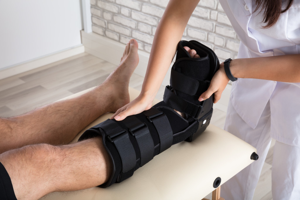 man with foot injury on a therapy