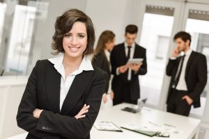 leader looking at camera in working environment