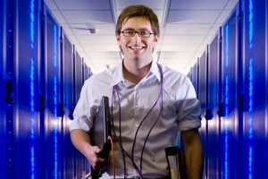 An IT expert in a server room