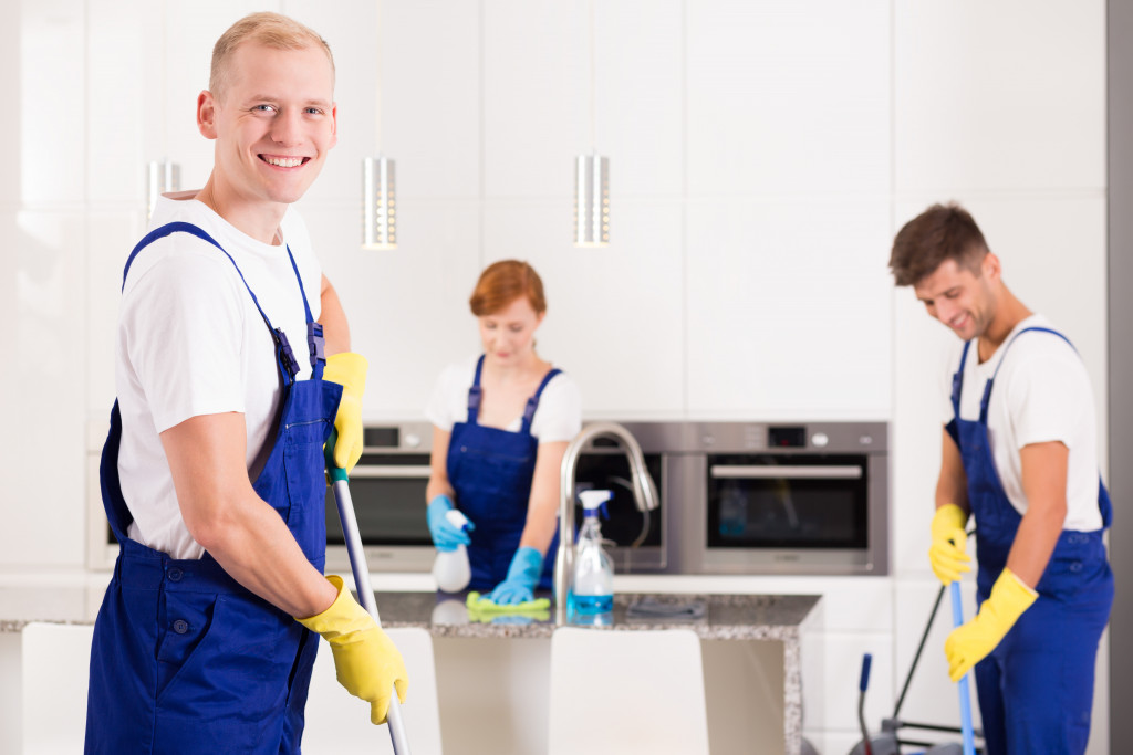 a group of cleaners in the kitchen area