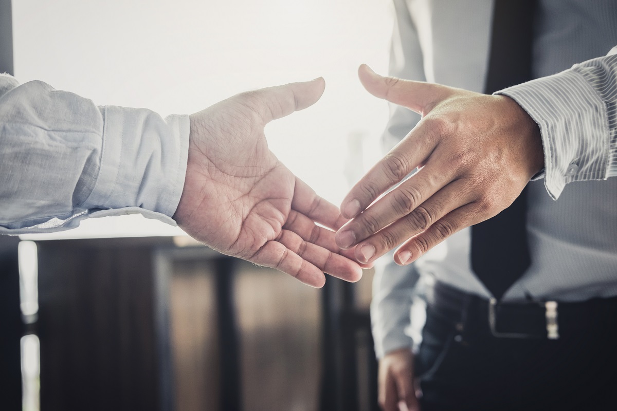 An image of businessmen having a handshake